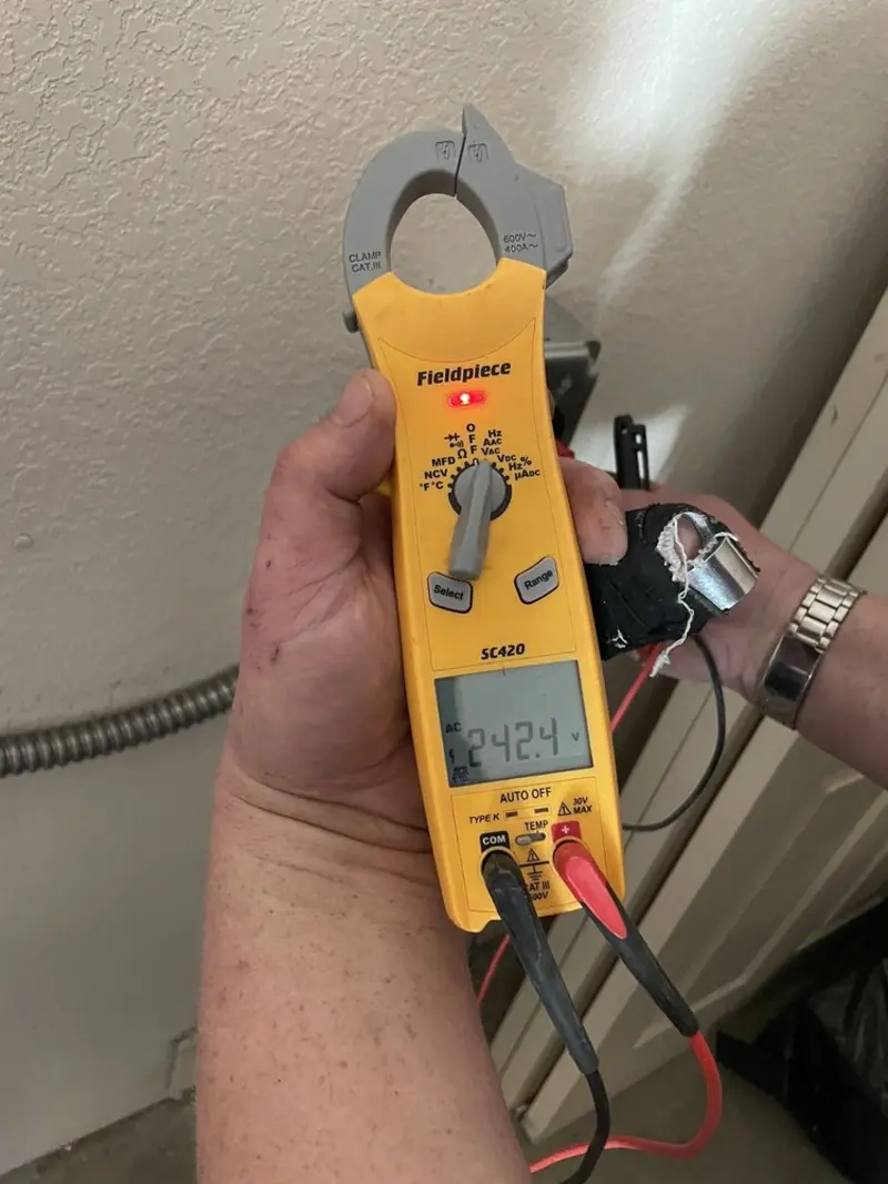 Voltage testing with clamp meter during Electrical Installation Services in Prairie Ridge